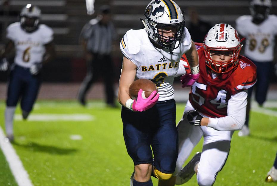 Tavian Miller moves forward with a ball